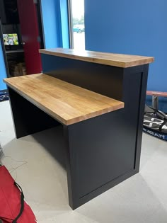 an office desk with a wooden counter top