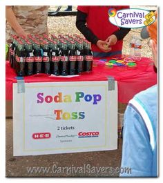 soda pop tosses are being sold at an outdoor vendor's table with a sign that says soda pop tosses