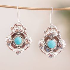 Add a touch of opulence to any look with these ornate antique-style earrings. Gianluca Anzani handcrafts them with braided and floral details in 925 sterling silver and finishes them with a serene turquoise cabochons. Gianluca Anzani is Swiss-Italian by birth but Mexican by choice since 1977 when he fell in love with the country he now calls home. He has worked and learned under multiple Mexican master silversmiths around and mixes both European and local influences in his designs. Turquoise Bohemian Earrings With Intricate Design, Bohemian Turquoise Earrings With Intricate Design, Sterling Silver Flower Earrings, Turquoise Dangle Earrings, Silver Chandelier Earrings, Silver Flower Earrings, Turquoise Earrings Dangle, Real Turquoise, Sterling Silver Flowers