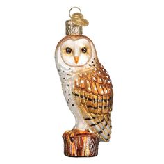 an owl ornament is shown on a white background