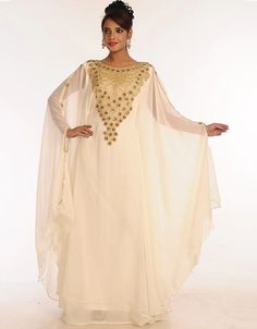 ❤️Inshallah❤️ Trendy Off White Georgette Hand Embroidery Party Wear Kaftan 👗 Order Online latest Embroidered Kaftan which are made up from best quality fabrics with latest styles from our large collections at arabicattire.com Shop Now : https://bit.ly/3Q59Xdo Buy online @ $71.5 #eveningkaftans #arabicapparel #middleeasternclothingonline #islamickaftan #fittedkaftandresses #longkaftandressesonline #dressykaftans #islamicclothingforsale #middleeastclothingforwomen Middle East Clothing, Kids Kaftan, Modest Evening Dress, Zari Embroidery, Long Kaftan, Georgette Dress, Hooded Dress, Islamic Clothing, Zari Work