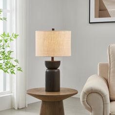 a living room scene with focus on the table lamp