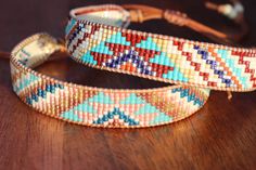 Introducing our adjustable southwestern beaded cuff bracelets! This colorful cuff bracelet is handmade with a southwestern-inspired pattern in cream, dark red, blue, orange, turquoise, and soft yellow.The bracelet is strung on strong beading thread and flexible leather cord with an adjustable closure, making it easy to put on and take off, while also allowing you to customize your fit. It will fit 6-8 inch wrists.Whether you're dressing up for a special occasion or just accenting your everyday s Adjustable Multicolor Southwestern Cuff Bracelet, Adjustable Southwestern Style Festival Cuff Bracelet, Adjustable Southwestern Cuff Bracelet For Festivals, Adjustable Southwestern Style Cuff Bracelet For Festivals, Southwestern Multicolor Adjustable Cuff Bracelet, Bohemian Beaded Cuff Bracelet, Southwestern Style Multicolor Beaded Cuff Bracelet, Multicolor Southwestern Cuff Bracelet For Festivals, Southwestern Multicolor Cuff Bracelet For Festival