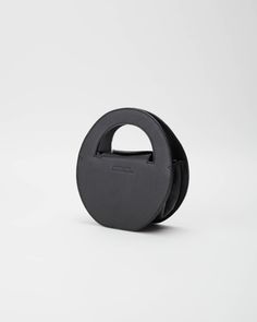 Circle Bag from Anissa Aida in Black Black Top Handle Bag With Detachable Handle, Black Top Handle Box Bag With Dust Bag, Designer Black Evening Bag With Removable Pouch, Black Top Handle Box Bag With Detachable Handle, Designer Black Evening Bag For Everyday Use, Black Box Bag With Detachable Top Handle, Black Satchel With Round Handle For Travel, Black Top Handle Evening Bag For Travel, Modern Black Bag With Detachable Handle