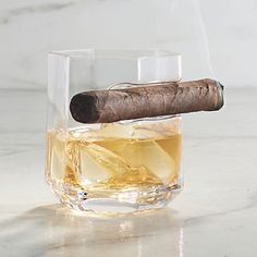 The Crystal Cigar Glass combines a classic double old-fashioned glass profile with a hexagonal base and a built-in cigar rest, creating a unique connoisseurs tumbler. Strikingly clear crystal perfectly shows off the liquor within, while a sturdy angled base provides a satisfyingly hefty foundation.Crafted of lead-free crystal. Includes built-in cigar rest. Cigar rest fits cigar ring gauges up to 54 . At Frontgate, our primary focus is quality. We guarantee that every product we sell will stand up to the supreme test   our customers satisfaction. To learn more about our policies, visit our Shipping & Processing, Returns & Exchanges and Warranty & Price Guarantee pages. Serveware Entertaining, Old Fashioned Glass, Leisure Time, The Supreme, Cigars, Serveware, Clear Crystal, Old Fashioned, Liquor