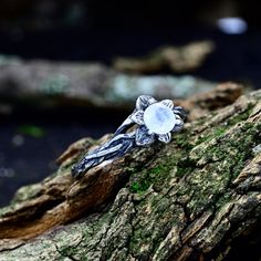 This enchanting ring captures the essence of nature with its mythical design, making it a perfect choice for a woman seeking a unique and witchy-themed wedding ring. Adorned with a moonstone, this piece is a testament to the enduring magic found in the intertwining branches of love and the enchanting allure of mythical realms. Characteristics: Metal - Recycled solid sterling silver  Stone - Moonstone Finish - Oxidized. View all silver withy rings: https://www.etsy.com/shop/TinyShinyJewel?ref=seller-platform-mcnav&section_id=44336283 Care instructions: To care for the ring, avoid contact with water and chemicals such as perfumes and lotions. When the ring is not in use, store it in a dry, cool place to prevent tarnishing. Additional information:  ✦ All rings are made to order. An average tu Silver Mystical Moonstone Ring, Adjustable Silver Magical Style Rings, Ethereal Moonstone Birthstone Ring, Adjustable Mystical Crystal Ring, Ethereal White Ring Jewelry, Mystical Moonstone Promise Ring, Magical Adjustable Silver Crystal Ring, Mystical Moonstone Ring, Silver Moonstone Crystal Ring In Moon Shape