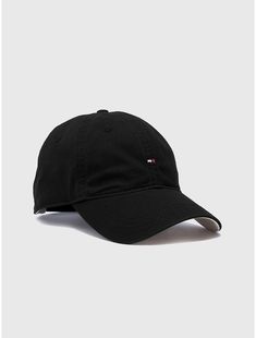 Tommy Hilfiger unisex hat. Rain or shine, our classic baseball cap has got you covered.  Material: 100% Cotton. Classic Black Baseball Cap With Curved Brim, Classic Baseball Cap With Curved Brim, Classic Snapback Baseball Cap, Classic Black Dad Hat With Curved Brim, Classic Black Baseball Cap With Curved Visor, Classic Solid Color Snapback Hats, Classic Solid Baseball Cap, Classic Snapback Hat With Curved Brim, Classic Solid Color Baseball Cap