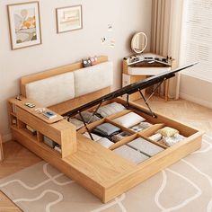 a bed with drawers underneath it in a room