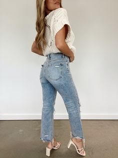 Get the perfect blend of comfort and style with our Vintage Wash Cropped Straight Denim. These high-waisted jeans have a distressed hem, button and zipper closure, as well as knee hole details. They fit straight and true to size. Pair with our Bestie Sweater for the perfect early fall look! High Rise Distressing On Knees And Hem Straight Fit 100% Cotton Hand Wash Cold Trendy Boutique Clothing, Lane 201, On Knees, Kinds Of Clothes, Early Fall, Light Denim, Fall Looks, Winter Style, Dresses Xs