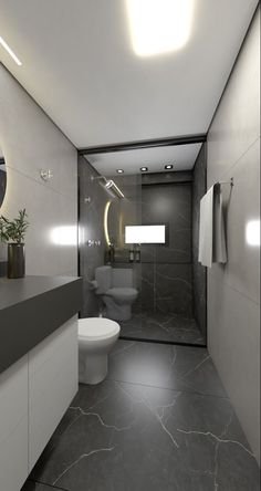 a bathroom with a toilet, sink and mirror