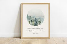 a watercolor painting with the bible verse on it and trees in the background, against a white wall