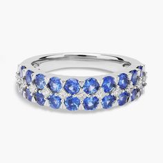 a white gold ring with blue sapphires and diamonds