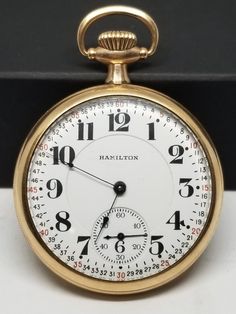 1920 Gold Filled Hamilton Pocket Watch, Grade 992, Size 16s, 21 Jewels, Works. Not timed for accuracy. Movement with, Hamilton Watch Co. Lancaster, PA., 21 Jewels, 992, Double Roller, Adjusted 5 Positions, 1552084. Inside back of case with, S.W.C. Co., Gold Filled, 20 Years, 4820126. Back of case engraved B E E. Dial looks good. Crystal with scratches. Case with minor wear to finish and scratches. Lever set and works fine. We do not test items to see how long or how accurate they run. All items we sell have had a previous owner(s). None, and I'll repeat it, none of our watches online are currently serviced unless they state so in the description. To get a watch overhauled (timing etcetera) it costs 3-400+ not including shipping both ways. If an Item that is listed states, "Running", it sim Classic Gold Stopwatch Watch Accessories, Classic Gold Watch Accessories With Stopwatch, Classic Formal Watch Accessory With Stopwatch, Classic Round Stopwatch Watch, Classic Round Watch With Stopwatch, Hamilton Watch, We Watch, Lancaster Pa, Pocket Watches