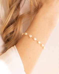 Elevate your outfit with the Lily Bracelet. This chunky pearl bracelet is a must-have addition to any fun and chic outfit. With an extender for easy wearing, it is one of our favorites. Stacked here with our Chloe Bracelet, Camilla Bracelet, and our Devon Bracelet. The sister to this is our Lily Necklace! Details: - Gold Filled - 2" extender Adjustable Pearl Drop Bracelets For Parties, Party Pearl Drop Beaded Bracelets, Chic Adjustable Pearl Bracelet With Pearl Charm, Chic Adjustable Pearl Bracelet With Charm, Chic Adjustable Pearl Bracelet, Wedding Pearl Charm Bracelet, Adjustable Chic Pearl Bracelet As Gift, Chic Adjustable Pearl Bracelet As Gift, Chic Adjustable Pearl Bracelet Gift