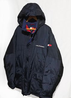 Vintage 90s Tommy Hilfiger Goose Down Proof Hooded Parka jacket Block Logo Spell Out Multi Pocket Navy Blue Size XL Condition: Normal Trace of Use Overall Good Size: X-Large lenght : 31,5 Pit to Pit: 27.5 Arms: 26 Any questions just ask! Please keep in mind that colours from the pictures may vary because of your screen. I SEND WITH TRACKING NUMBER! If any item is lost or damaged in transit I will make a claim with the Post Office but refunds will not be given until the claim has been processed. 90s Winter Outerwear With Drawstring Hood, 90s Hooded Outerwear For Outdoor, 90s Style Hooded Outerwear For Outdoor, 90s Style Winter Windbreaker With Pockets, 90s Blue Outerwear With Pockets, 90s Style Blue Outerwear With Pockets, 90s Style Outerwear With Pockets For Winter, 90s Tommy Hilfiger, Block Logo