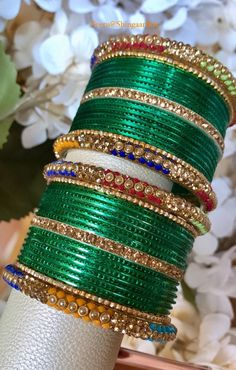 Beautiful simple yet elegant bangle set.  Only available in size 2.4 only.  You will receive 24 green bangles, 4 side bangles and 6 accent bangles as shown in images. Color, shades, texture displayed may slightly vary from the actual product due to digital image limitations. Care: It is advisable that you keep our products away from direct heat, humidity, and moisture.  Please do not use Perfume/spray on the products. We at ShingaarBox doing our best to keep all our products clean and sanitized.  Thank you for your business and stay safe. Diwali Party Bracelets With Zari Work, Traditional Party Bangle With Zari Work, Zari Work Bracelets For Diwali Party, Traditional Bangle With Zari Work For Parties, Party Jewelry Bangle With Zari Work, Green Jewelry With Stone Work For Diwali, Bollywood Style Bracelets With Zari Work For Parties, Gold Bangle With Zari Work For Party, Green Jewelry For Wedding And Navratri