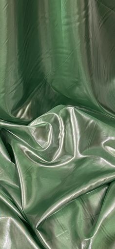 a close up view of a shiny green cloth