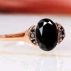 Waxing Gibbous – an enchanting engagement ring inspired by the moon’s waxing gibbous phase. Crafted in rose gold, it features a 2.72-carat oval-shaped natural black diamond as its centerpiece. Accented by 0.14 carats of round black and white diamonds, the Waxing Gibbous ring, with a total carat weight of 2.86, captures the moon's ethereal beauty and timeless allure. Ideal for those who appreciate the extraordinary elegance of natural black diamonds. Waxing Gibbous Phase, Diamond Oval Engagement Ring, Black Diamond Necklace, Black Diamond Studs, White Diamond Earrings, Black Diamond Earrings, Oval Engagement Ring, Halo Necklace, Oval Diamond Engagement Ring