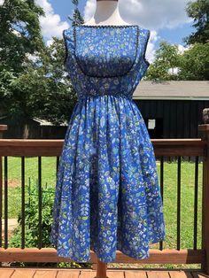 "Such a pretty blue floral dress! I love the accordion bib outlined in black rickrack trim. This dress can be transitioned from spring-autumn in my opinion. Just add a cropped cardigan for a more vintage look or a fitted denim jacket for something more hipster! You will most likely need a slip as she is fairly sheer. For the future owner: Please send picture, because I LOVE this one! Excellent vintage condition! Measurements taken flat, please double: Bust 19\" Waist 13\" Length 38\" All sales a 60s Girl, 1950’s Fashion, Jeanne D'arc, Dresses 1950s, Fitted Denim Jacket, Blue Floral Dress, Fashion 1950s, Jeanne D Arc, Taffeta Dress