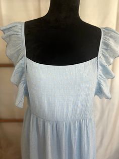 Baby Blue color with a tan dot stitch Featuring a flutter sleeve Square Neck Side zipper Tie Back Lined underneath 100% Rayon 100% Polyester Lining Baby Blue Color, Baby Blue Colour, Flutter Sleeve Dress, Tie Backs, Tie Back, Flutter Sleeve, Square Neck, Side Zipper, Baby Blue