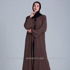 Embrace The Timeless Allure Of Our Cascading Elegance Abaya, A Perfect Fusion Of Grace And Contemporary Style. Crafted From Rich Brown And Black Fabrics, This Abaya Exudes Sophistication. Here's Why It's A Wardrobe Essential: Matching Hijab: This Abaya Comes With A Matching Hijab No More Searching For The Perfect Match, We've Taken Care Of It For You. Buy A Complete Abaya Look Today. Size L - Length 56 Inches Size Xl- Length 58 Inches Graceful Cascade: The Fabric Drapes Gracefully, Creating A Ca Brown Long Dress For Eid, Long Brown Dress For Eid, Long Brown Dresses For Eid, Elegant Brown Long Sleeve Thobe, Elegant Long Sleeve Brown Kaftan, Elegant Brown Long Sleeve Kaftan, Elegant Long Sleeve Brown Abaya, Brown Long Sleeve Khimar For Eid, Brown Long Thobe For Eid