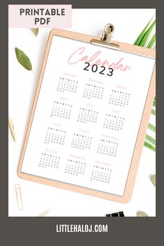 a clipboard with the text printable calendar on it