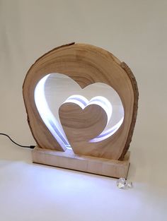 a wooden sculpture with a heart cut out of it