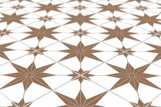 an abstract pattern made up of brown and white stars