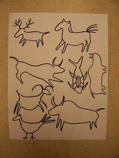 an image of some animals drawn in black and white on a piece of parchment paper