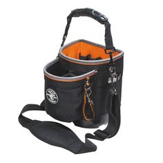 a black bag with an orange pocket on the front and straps hanging off it's side