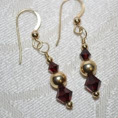 Felicity Fairchild 14k Gold Garnet and Crystal Earrings | Etsy Anniversary Jewelry With Faceted Garnet, Anniversary Garnet Faceted Jewelry, Anniversary Faceted Garnet Jewelry, Formal Garnet Faceted Jewelry, Formal Faceted Garnet Jewelry, Elegant Burgundy Dangle Jewelry, Elegant Faceted Garnet Earrings, Faceted Garnet Jewelry In Yellow Gold, Elegant Burgundy Jewelry With Faceted Beads