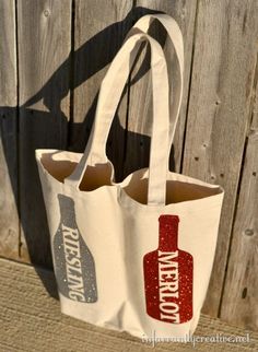 a white tote bag with a bottle on it