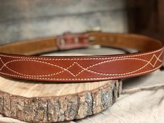 Our beautiful hand-crafted Western stitched English Bridle Vegetable-tanned leather belts that we line with a beautiful tan suede giving this belt durability and strength, yet still making it flexible for comfort. The thickness (13oz.) of this belt is perfect for carrying a gun or other accessories that attach to your belt, or if you prefer to wear for the high end appearance this gives any attire. **COLOR PREFERENCE -Golden Brown -Buck Brown -Rich Brown -Havana **BUCKLE PREFERENCE -Antique Nick Classic Adjustable Embroidered Belt, Fitted Leather Belts And Suspenders, Western Belts With Belt Loops For Everyday Use, Leather Western Belts For Everyday, Concealed Carry Belt, Belt Western, English Bridle, Tan Leather Belt, Tan Suede