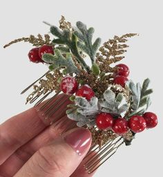 "This pretty Christmas bridal hair comb features a lovely collection of frosty berries, Dusty Miller leaves, and little fronds of golden fern. This would look lovely just plunked into the back of an up and down do or gifted to bridesmaids for a festive accessory. The purchase of this listing is for one Christmas berry comb with the following specifications and options: Style: Holly Berries, Dusty Miller, and Golden Fern. Measurements: 4\" length x 1.5\" width. Hair Comb Finish: Nickel, Gold, Bro Christmas Hair Piece, Peony Hair Piece, Berry Hair, Christmas Headpiece, Winter Wedding Hair, Flower Hair Accessories Wedding, Boho Bridal Hair, Blue Hair Accessories, Decorative Hair Combs