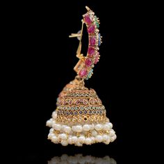 An entrancing ensemble defining a luxurious dream! A sensational pair of earrings depicting classic nauratan stones - perfectly complemented by traditional jhumki design with pearl moti finishing. Approximate earrings length is 3". Kindly click on the video for a detailed view of the product. Gold-plated on high-quality brass as base metal. Made by order. Kindly allow 5-7 weeks for the delivery of this item. For custom or urgent requests, please contact support@alacouture.com. *Please Note: The Faux Stone, Base Metal, Free Gifts, Plating, Brass, Beads, Stone, High Quality, Gold