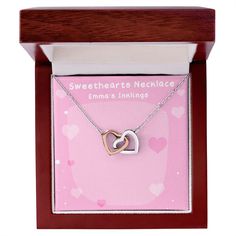 Give her the gift that symbolizes your never-ending love. Featuring two lovely hearts embellished with cubic zirconia crystals, this Interlocking Hearts necklace is the perfect accessory for everyday wear. Whether it's a memorable anniversary or a special birthday, make sure to dazzle your special someone by gifting them this stunning necklace. Two heart pendants embellished with CZ crystals High quality polished surgical steel and rose gold finish or 18k yellow gold finish Pendant dimensions: 0 Heart Jewelry With Gift Box For Her, Open Heart Necklace With Diamond Accents For Gift, Double Heart Cubic Zirconia Jewelry Gift, Elegant Valentine's Day Necklace With Gift Box, Elegant Valentine's Day Necklace In Gift Box, Gift Jewelry With Diamond Accents Open Heart, Gift Jewelry With Diamond Accents In Open Heart Shape, Open Heart Diamond Accents Necklace Gift, Open Heart Jewelry With Diamond Accents For Gifts