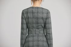 "Retro wool plaid long sleeves dress in classic hues of gray, black and white. This dress features a round neckline,fitted waist, fully lined and a back zipper closure. Details: * plaid wool fabric with fully polyester lining * long sleeves * round neckline * back zipper closure * no pockets * knee length * with buttons decoration * womens dresses, winter dress SIZE GUIDE Size vary between Brand and Country Please get your body measurement with our Size Guide And Find your size in our Size Chart Wool Long Sleeve Dresses For Work, Plaid Midi Dress For Work, Long Sleeve Wool Dresses For Office, Office Wool Dresses With Long Sleeves, Plaid Midi Dress For Fall Workwear, Plaid Long Sleeve Midi Dress For Work, Wool Long Sleeve Midi Dress For Work, Winter Plaid V-neck Dress, Plaid V-neck Winter Dress