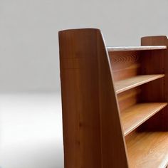 a close up of a wooden shelf with shelves