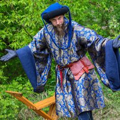 ✨ Brocade with linen lining! 14th & 15th century! Step back in time with our exquisite men's patterned houppelande, a medieval masterpiece inspired by the late 14th and early 15th centuries. Crafted from patterned brocade in a variety of colors and lined with 100% linen, this houppelande is the epitome of historical authenticity. 🛒 Visit our shop on Etsy: https://www.etsy.com/pl/shop/SPESMedievalMarket  📝 Key Features ◾ Authentic Design: Our houppelande faithfully recreates the elegance of the Winter Medieval Dress For Larp With Historical Design, Medieval Dress For Larp And Medieval Festivals, Winter Medieval Dress With Historical Design, Traditional Medieval Dress For Larp And Festivals, Medieval Costume Dress With Historical Design, Traditional Medieval Dress For Larp And Medieval Festivals, Historical Medieval Festival Costume Dress, Winter Medieval Dress Costume With Historical Design, Traditional Medieval Dress For Fantasy Events