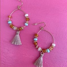 Elevate your summer style with our exquisite Coastal Rose Earrings, designed to bring a touch of coastal chic elegance to your look. These stunning statement earrings feature delicate pink beads and flowing fringe, perfect for any beach lover seeking a pop of color. Crafted with meticulous attention to detail, the Coastal Rose Earrings blend a radiant golden base with soft pink hues, capturing the essence of a beachy sunset. The pink beaded fringe sways gracefully, adding a playful yet sophistic Pink Beaded Fringe Earrings For Beach, Bohemian Tassel Earrings With Fringe For Spring, Beaded Drop Earrings With Tassels For The Beach, Beaded Tassel Drop Earrings For Beach, Pink Tassel Beaded Earrings For Beach, Trendy Beach Earrings With Colorful Beads, Spring Bohemian Beaded Dangling Earrings, Spring Bohemian Tassel Earrings, Colorful Beads Dangle Tassel Earrings For Beach