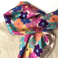 Square csatin scarf with colorful flowers. A luxury floral accessory for all kind of women. For multiple uses; as a scarf, or head cover like hijab or handbag accessory. The print is designed by me. Lenght 64 cm, wide 64 cm. For shoppers in United States and Canada: https://www.etsy.com/listing/1190403457 Other scarves in my shop: https://www.etsy.com/shop/MiracolaBottega?ref=seller-platform-mcnav&section_id=29230145 Each item will be wrapped in attractive wrapping paper and carefully send. It is ready for gift giving. If you have special wishes, please let me know.  You can follow me on Instagram and Pinterest: Pinterest: https://nl.pinterest.com/miracola2758 Instagram: @miracolabottega Pink Floral Print Shawl Scarf, Floral Patterned Silk Scarf, Trendy Multicolor Floral Print Scarves, Trendy Multicolor Floral Print Scarf, Multicolor Floral Print Shawl For Summer, Pink Floral Print Feminine Scarves, Pink Feminine Floral Print Scarves, Feminine Pink Floral Print Scarves, Silk Scarf With Floral Print For Gift