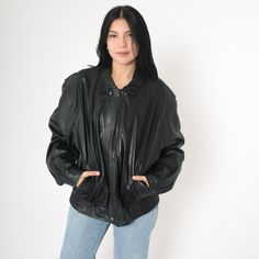 Vintage 90s jacket in black leather with a zipper up the front. Please see measurements and condition below. Every garment we sell is authentic vintage and one-of-a-kind! You will receive the exact item photographed. Condition: Very good vintage with light general wear. Size label: Labelled 42 Tag: Remy Material: outershell 100 leather lining 50 bemberg 50 Acetate Era: 90s MEASUREMENTS Taken from seam to seam while the garment is lying flat. Double the armpit, waist, and hips For reference, mode 1990s Men, 90s Jacket, Black Leather Jacket, Rocker, Zip Ups, Bomber Jacket, Black Leather, Halloween Shopping, Jackets & Coats