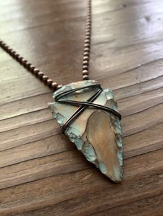 "This rad arrowhead is a modern knapped Jasper specimen that I have finished with unique, layered patinas. The turquoise patina looks so cool with the highlights of gold. I securely wire wrapped the arrowhead with pure, oxidized copper wire and attached it to a solid copper ball chain with a hand forged jump ring. This necklace and pendant has a tribal/boho vibe and is suitable for both guys or gals. The arrow or arrowhead is symbolic of forward movement and progression, strength and protection. Rustic Patina Jewelry For Festival, Rustic Handmade Arrowhead Necklace, Diy Arrowhead Necklace, Arrowhead Wrapping, Diy Arrowhead, Wrapped Arrowhead, Wire Wrapped Arrowhead, Barbarian Art, Head Wrapping