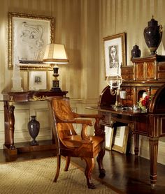 an old fashioned desk and chair in a room