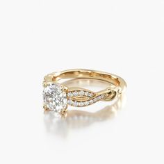 a yellow gold engagement ring with an oval cut diamond