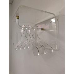 a wall mounted glass rack with wine glasses on it