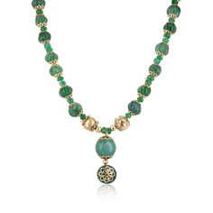 Introducing our exquisite Natural Emerald Carved Beaded Pendant Necklace. This stunning piece features a captivating array of round cabochons, rondelles, and intricately hand-carved emeralds, each meticulously crafted to create a unique and eye-catching texture. The highlight of this necklace is an earthy, breathtaking round cabochon emerald pendant, adorned with beautiful floral golden etchings, set in 14k yellow gold with silver gold plating. This pendant adds a touch of elegance and sophistic Luxury Green Cabochon Necklace, Elegant Jade Cabochon Necklace, Luxury Beaded Yellow Gold Necklace, Luxury Necklaces With Round Natural Stones, Luxury Necklaces With Polished Round Beads, Artisan Jewelry With Polished Round Pendant Beads, Luxury Necklace With Polished Round Beads, Artisan Jewelry With Polished Beads And Round Pendant, Luxury Beaded Necklaces With Gemstone Beads