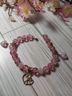 "Heart Charm Bracelet is handmade with on heavy duty nylon. It is 8\" long and has 3 Heart Charms on it. There's 18: 8mm Pink Crackled Glass beads and 2: 5mm Pink Faceted beads on this piece. 2 Charms are beautiful Pink swirl Heart shaped glass that are 10mm x 10mm And the double Silver Heart is 15mm long x 18mm wide. It has a lobster claw clasp. This elegant statement piece would look stunning on your wrist!" Charm Bracelet Pink, Glass Beaded Bracelet, Bracelet Heart, Pink Swirls, Glass Beaded Bracelets, Pink Bracelet, Bracelet For Women, Heart Bracelet, Heart Charm Bracelet