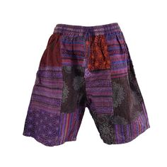 Unisex handsewn patchwork shorts made in Nepal. These high quality shorts are thicker and more durable than your standard cotton shorts. Features:  - As these are handmade the locations of the patches may vary. However, the general colour will remain the same. - Elastic waist with a draw string - 2 side pockets - 1 back pocket Sizes:  *As these are handmade these dimensions may vary slightly M: *        Elastic waist: 68-106cm *        Outseam: 51cm *        Inseam: 21cm L: *        Elastic wais Purple Cotton Patchwork Bottoms, Purple Patchwork Cotton Bottoms, Purple Cotton Shorts With Pockets, Bohemian Patchwork Shorts, Multicolor Hippie Shorts For Festival, Multicolor Hippie Style Festival Shorts, Multicolor Hippie Festival Shorts, Hippie Patchwork Shorts For Festival, Summer Festival Shorts With Patchwork