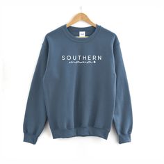 FREE SHIPPING (US Only) Southern Mama Sweatshirt | Mama Sweatshirt - Mama Shirt - Shirt for Mom - Mother's Day Shirt This adult sweatshirt is super soft; SIZE UP for a slouchy/oversized look. This sweat will quickly become your favorite. Perfect for joggers, the gym and really anything! --------------------------------------------- Southern Mama Sweatshirt * Hand Printed in White Ink * All Colors are Cotton/Poly Blends * Hand Printed in the USA --------------------------------------------- * ADU Cotton Sweatshirt With Name Print, Casual Cotton Sweatshirt With Name Print, Casual Blue Sweatshirt With Name Print, Mama Bear Sweatshirt, Country Girl Shirts, Mama Bear Shirt, Funny Coffee Shirts, Word Shirts, Cat Mom Shirts